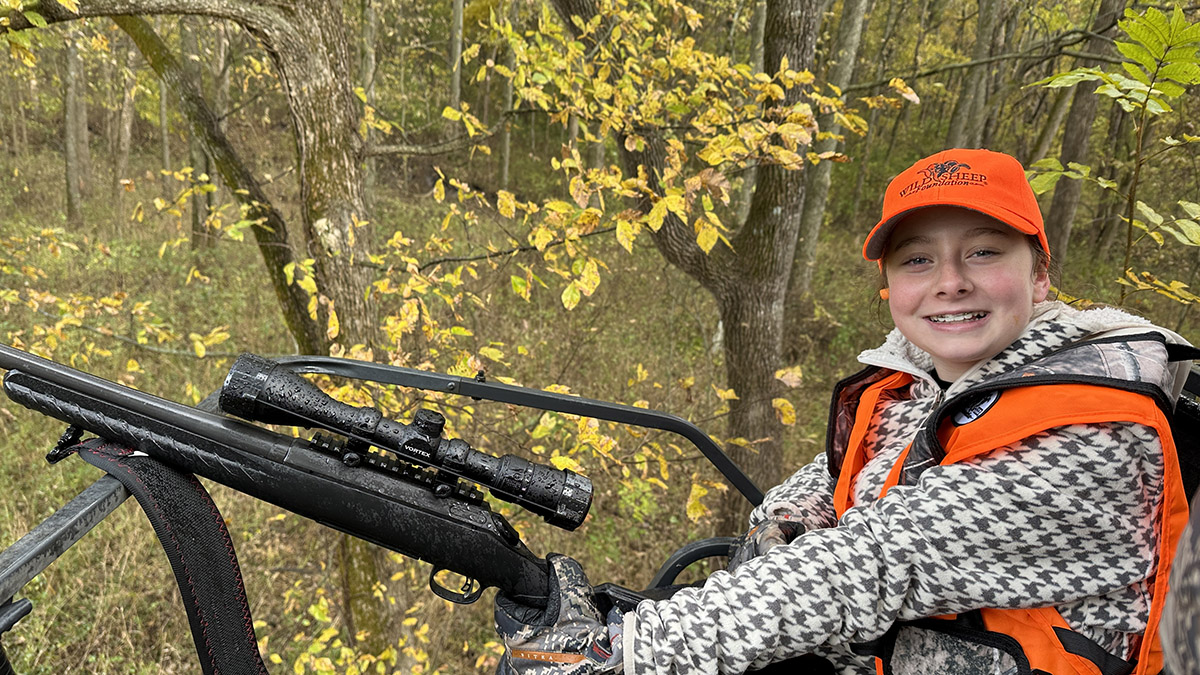 Young hunter in a deer stand Young hunter in a deer stand